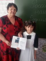 Чтение стихов В.Зайцевой о родном крае. Фото  с правнучкой.